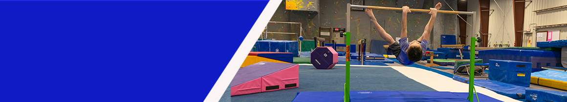 Gymnastics mats and tumbling equipment in gym