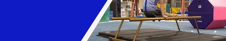 Child practices gymnastics in gym with octagons and multi-purpose mats