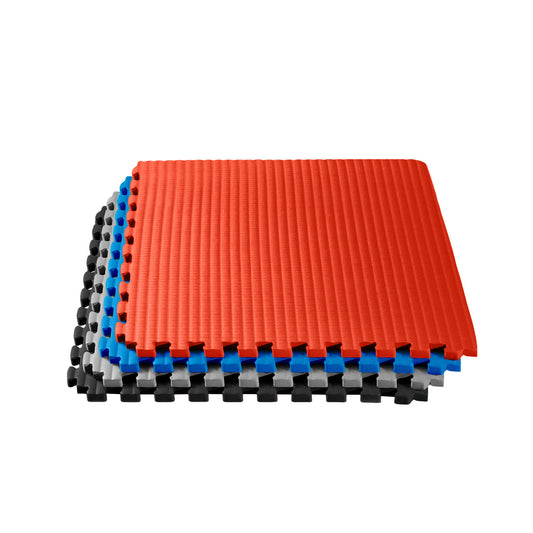 3/4" thick martial arts mats stacked all colors